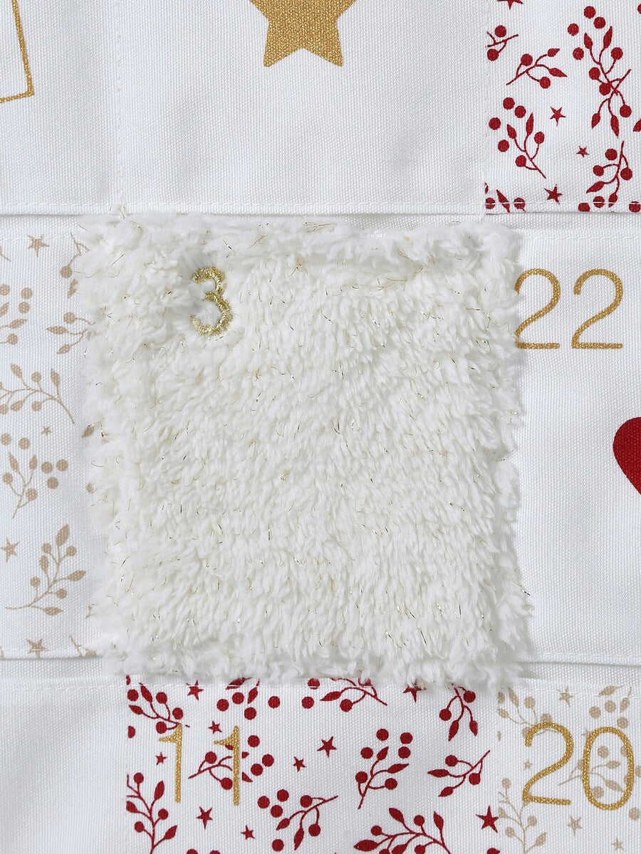 Adventskalender reinsdyr med gyllent gevir montert på vegg