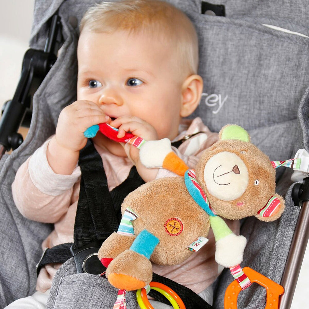 Aktivitetsleke Teddy Oskar med klemme og bjelle liggende