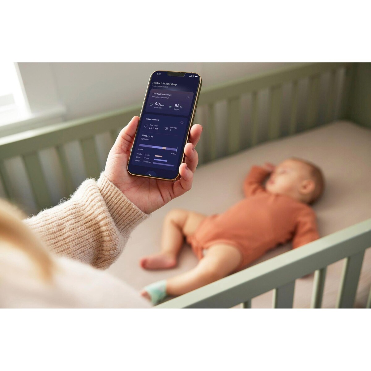 Nærbilde av Babycall med pulsoksimeter Dream Sock 0-18 mnd skjerm