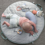 Babygym i tre med lekematte og pute Cozy Spot sammenfoldet