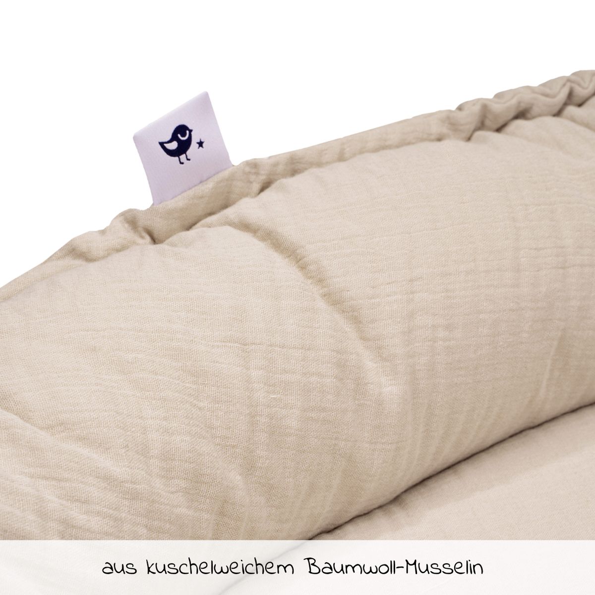 Babynest NIDO i bomullsmusselin, sand detalj av stoff