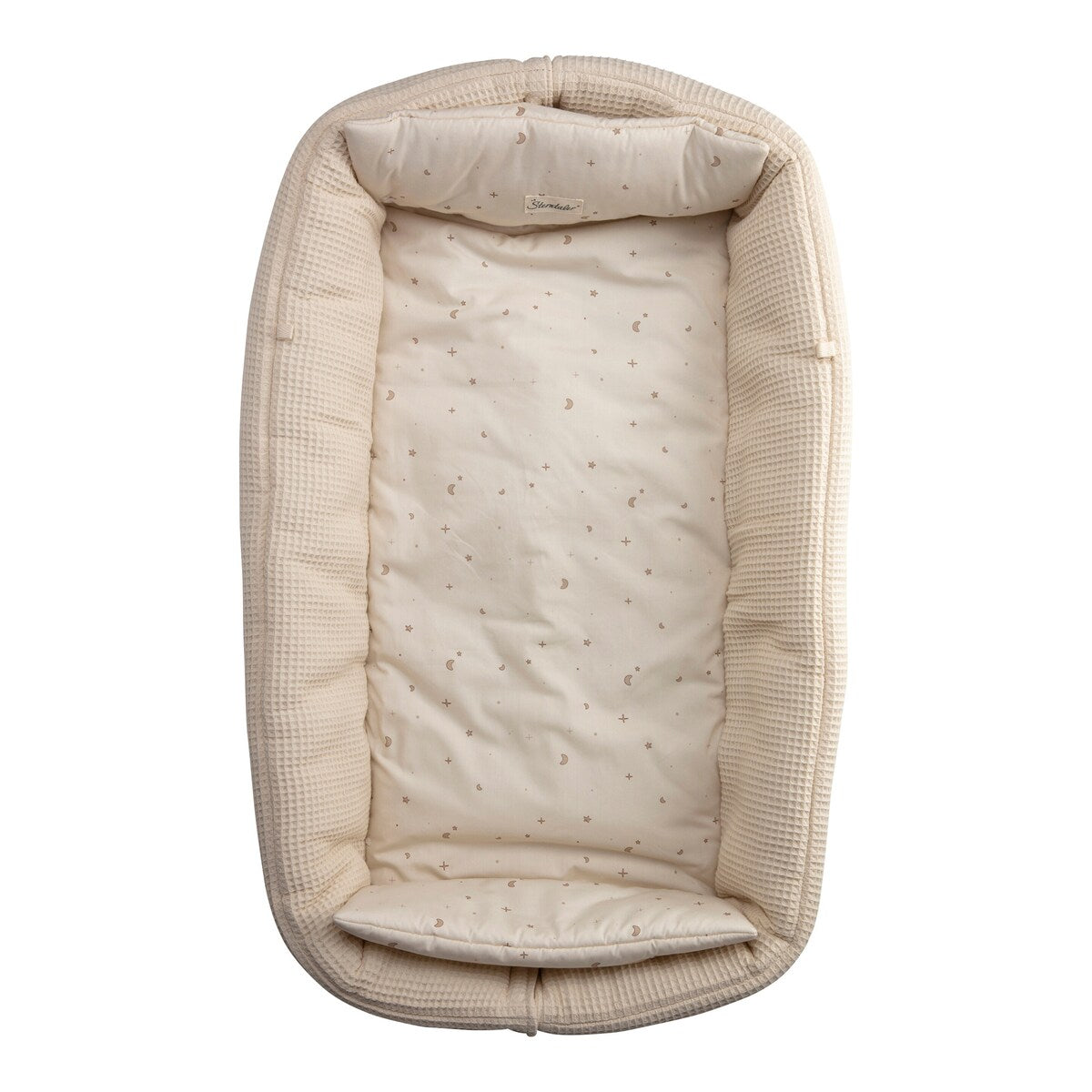 Babynest i vaffelpiqué med vendbart design bakside med ensfarget mønster
