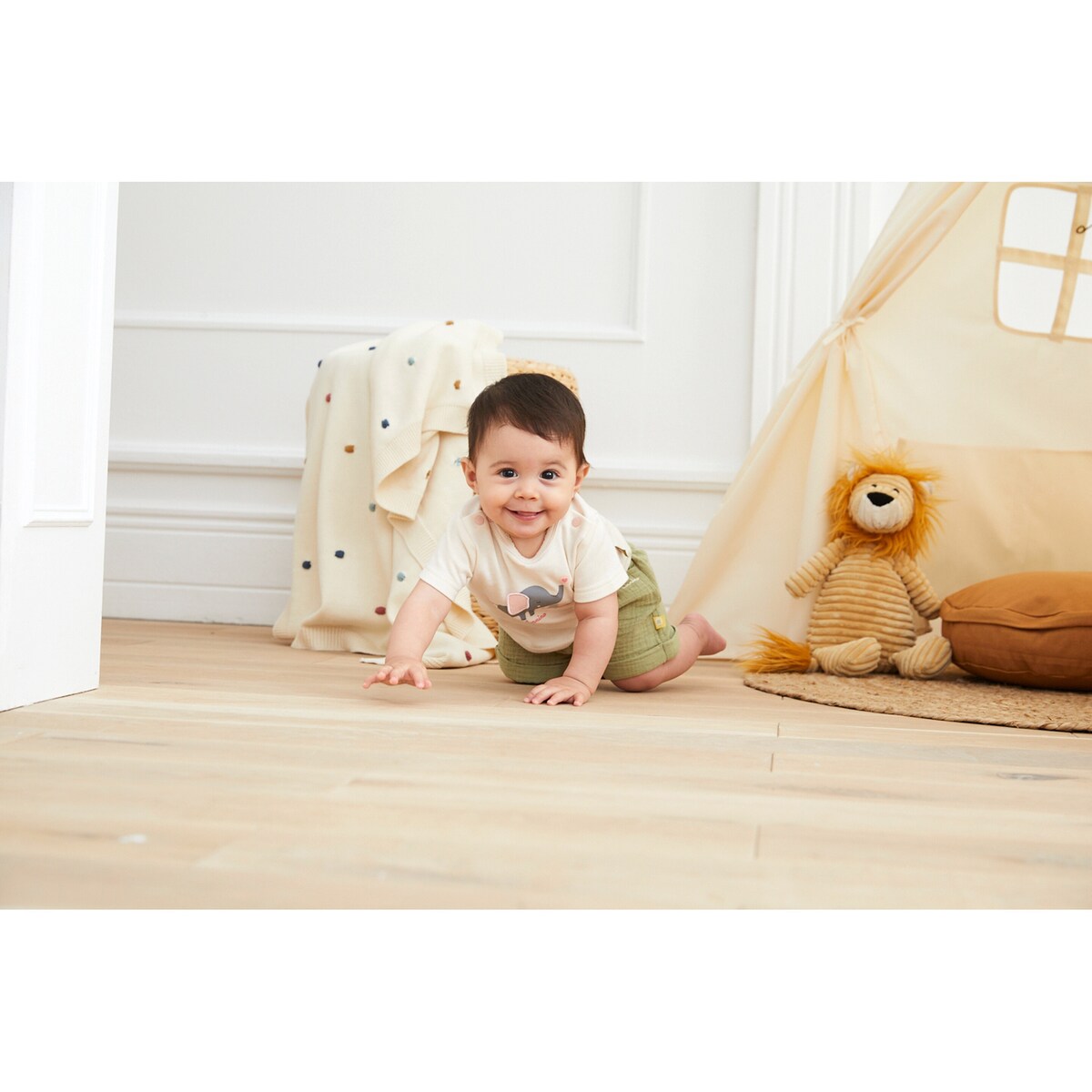 Babyteppe Dots strikket bomull 80x100 cm montert i barnets vogn