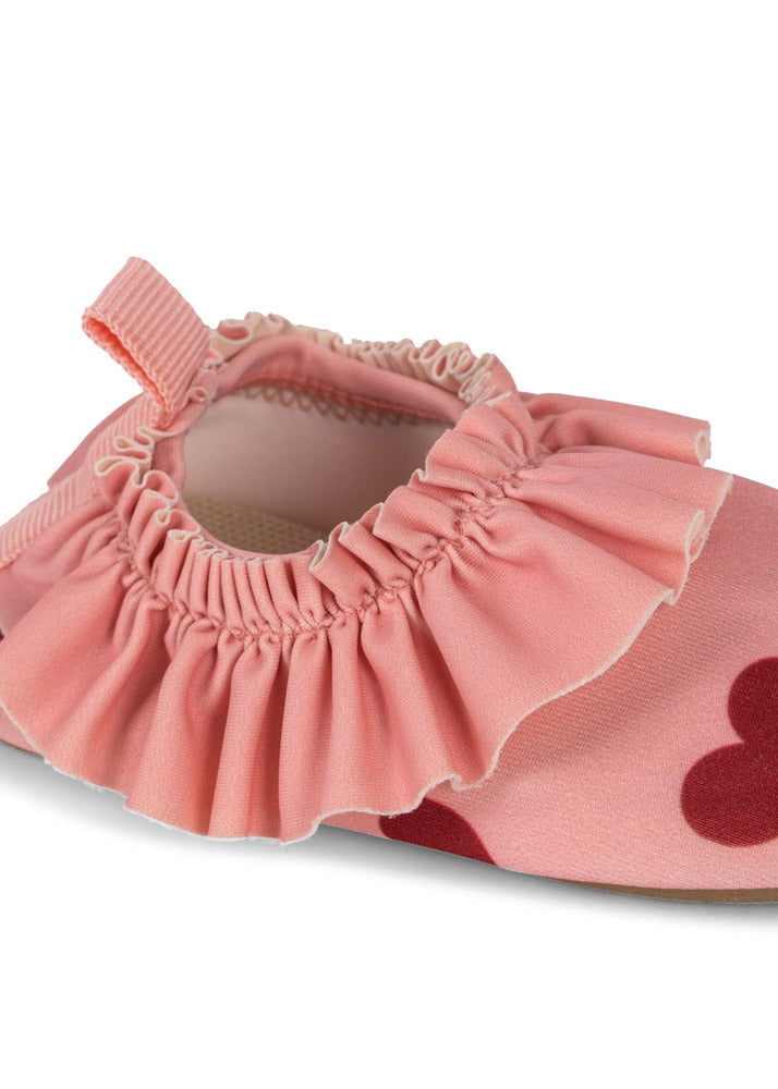 Nærbilde av stoff på Badesko Merle amour pink UPF 50+ str. 24-25