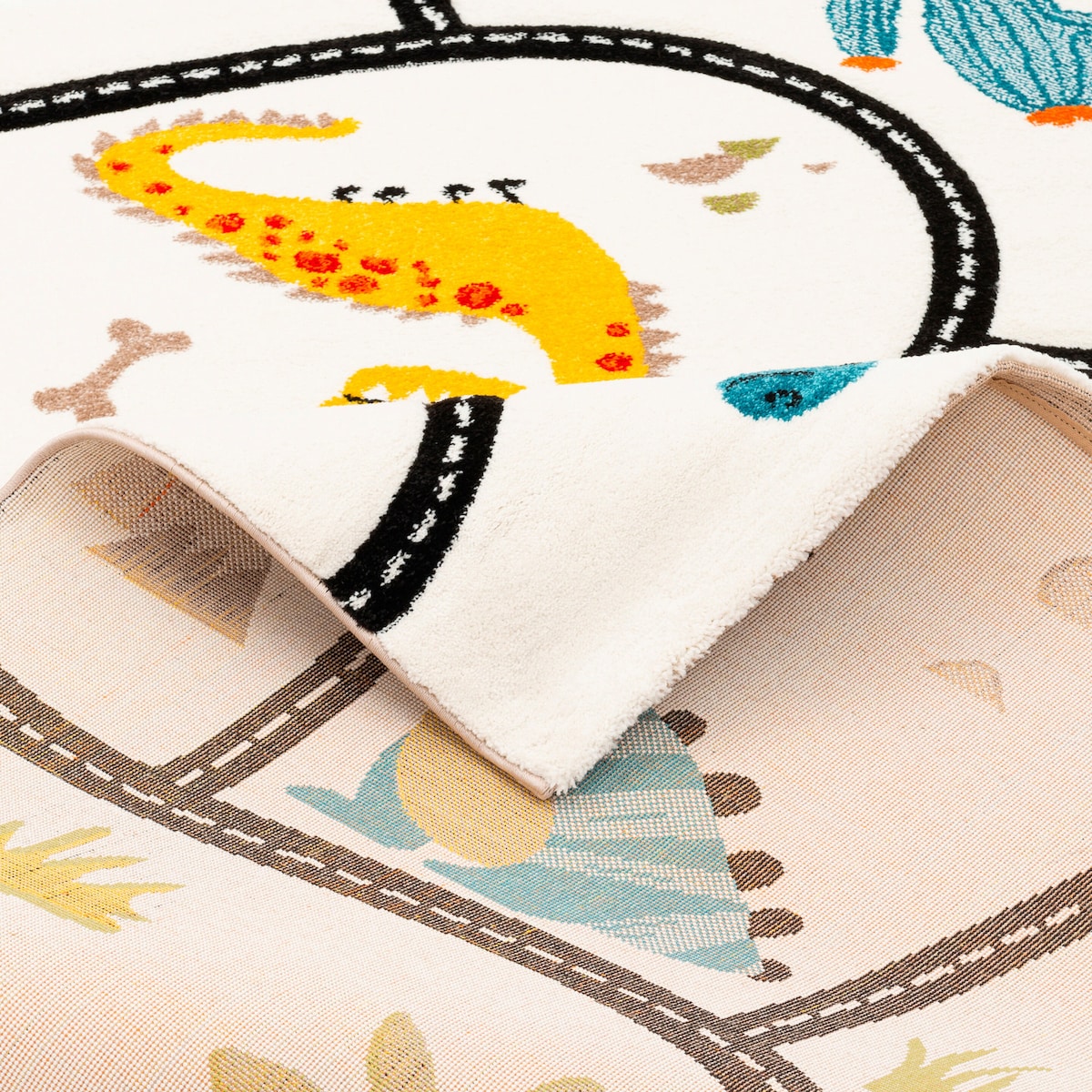 Barneteppe Maui Kids dino med veimotiv detalj av kant