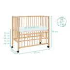Nærbilde av bedside crib Cocon 40x90 cm massiv bøk med hjul spiler