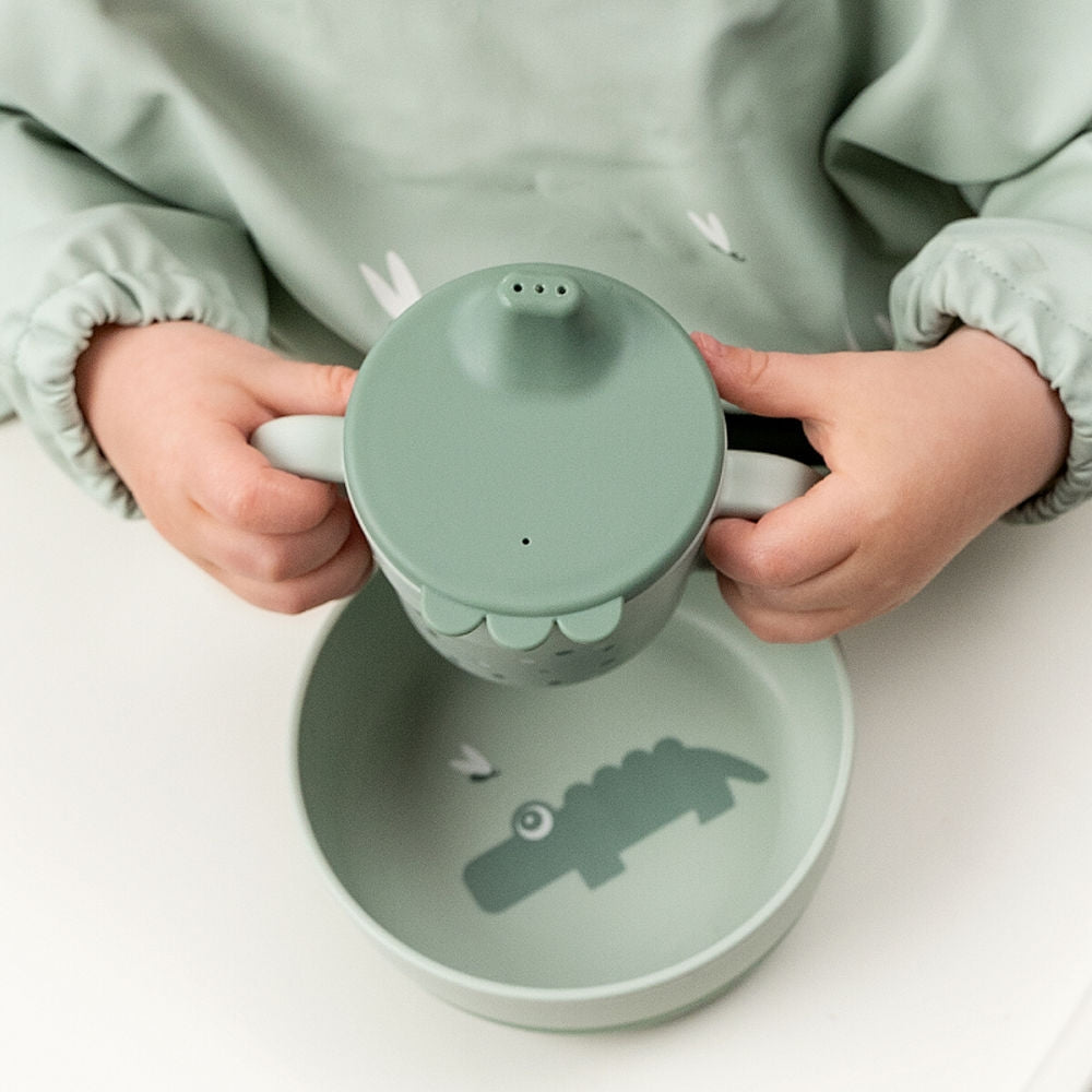 Nærbilde av håndtak på Drikkekopp med tut Foodie Happy Dots grønn