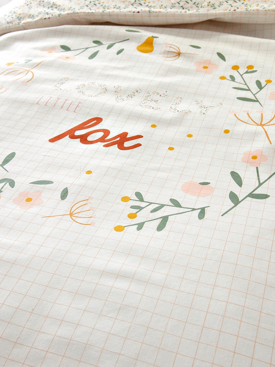 Bakside av dynetrekk for baby uten putetrekk blomstermotiv