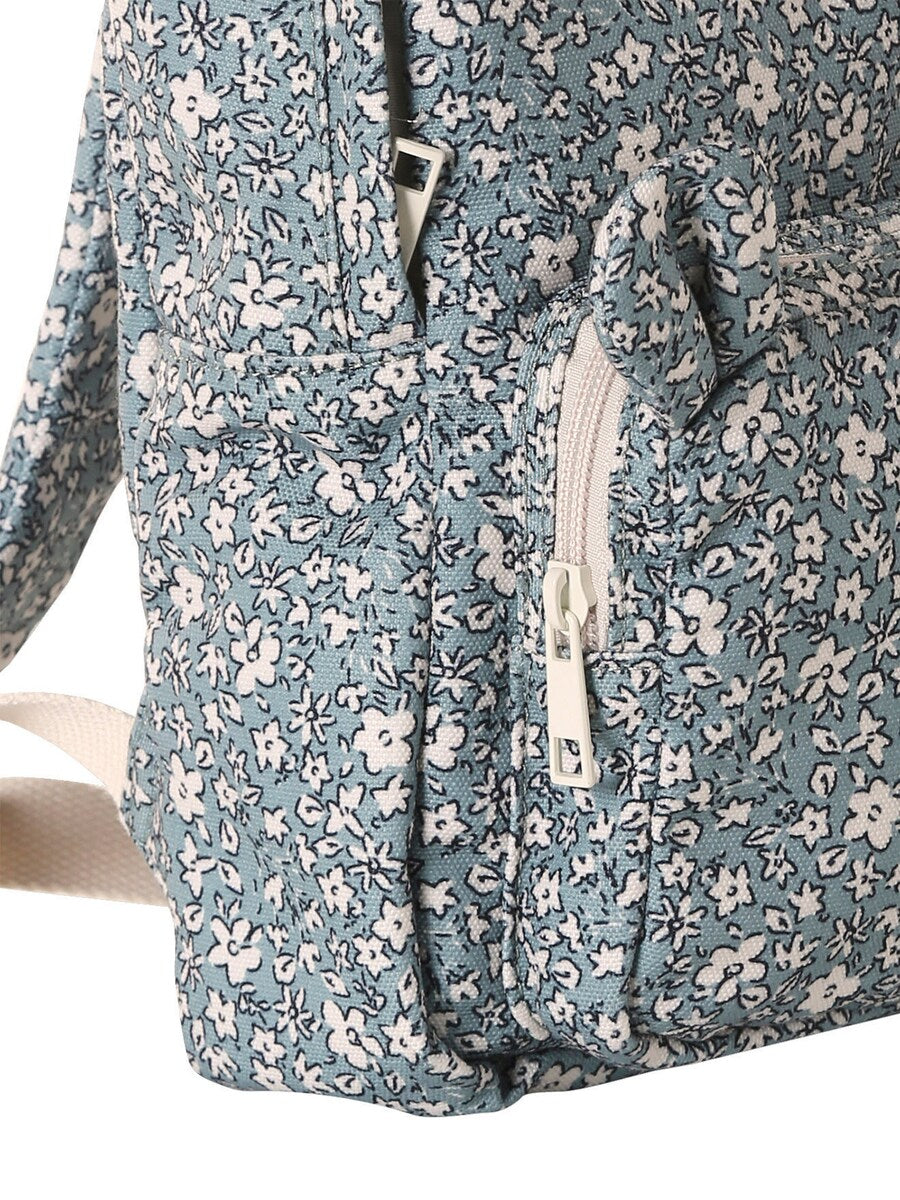Førskoleryggsekk for jenter med blomstermotiv montert på rygg