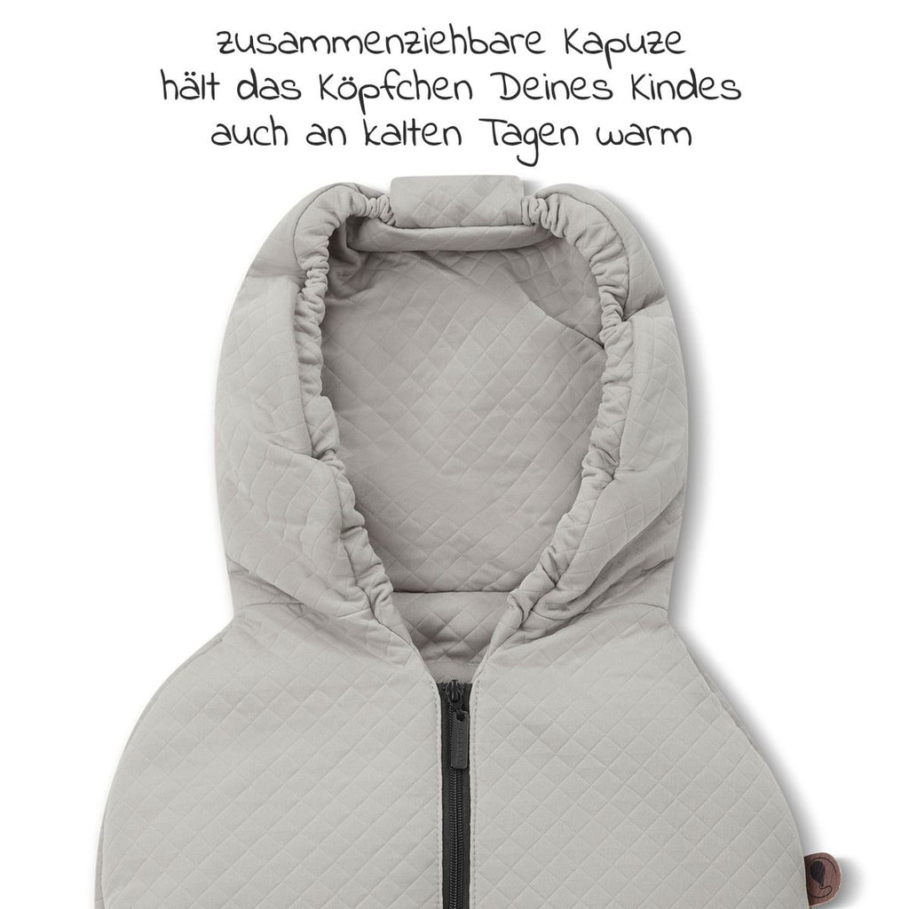 Detalj av gurtschlitze på Fotpose til babystol og bærebag Diamond Edition powder