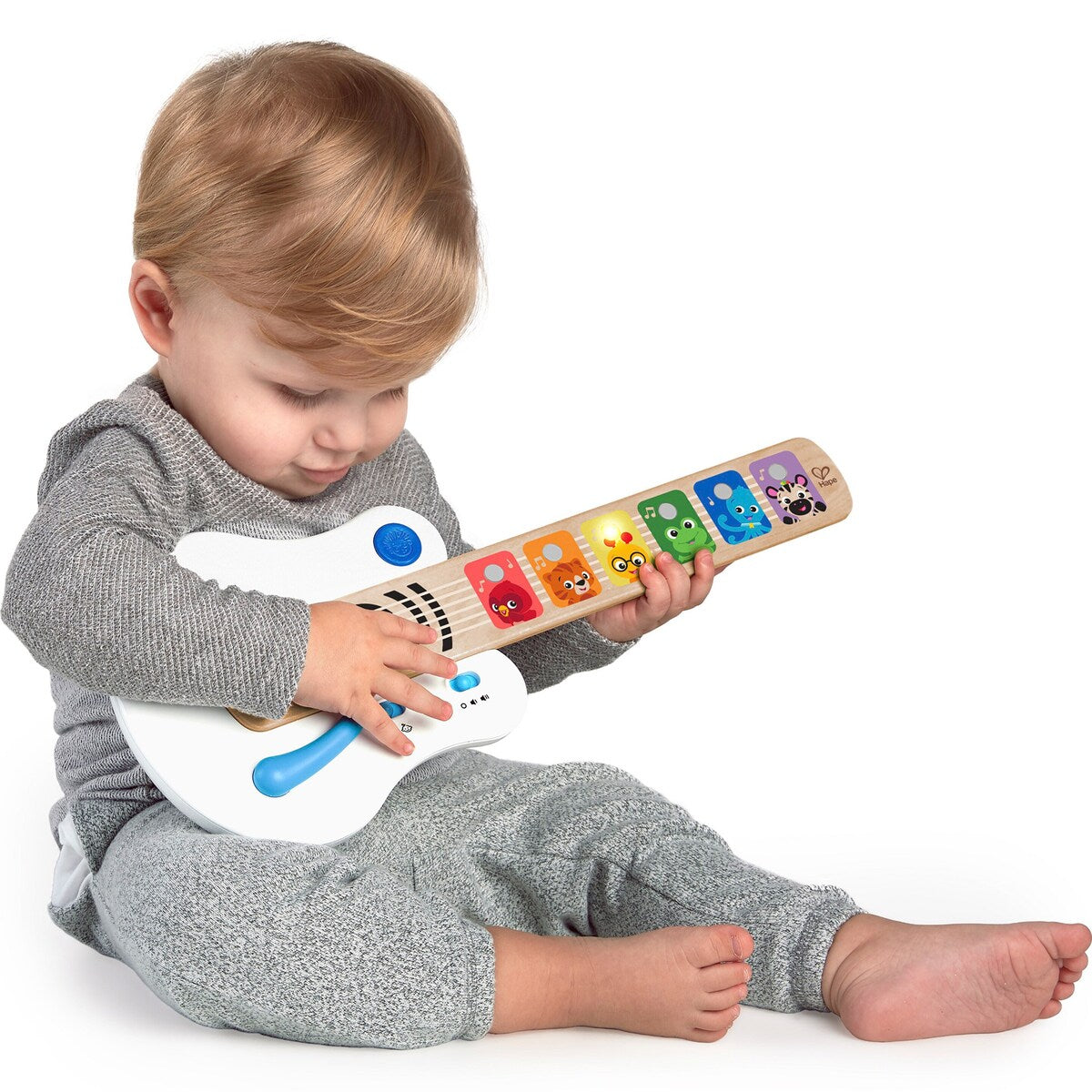 Detalj av knapper på Gitar Magic Touch i tre med 2 spillmoduser