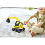 Gravemaskin i tre med bevegelig arm montert med figur