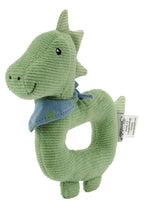 Nærbilde av rangle og stoff på Gripering Dino Rexi