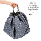 Nærbilde av trådløkker på Leketeppe 2-i-1 med bag og vannavvisende underlag grå hvit Zamboo