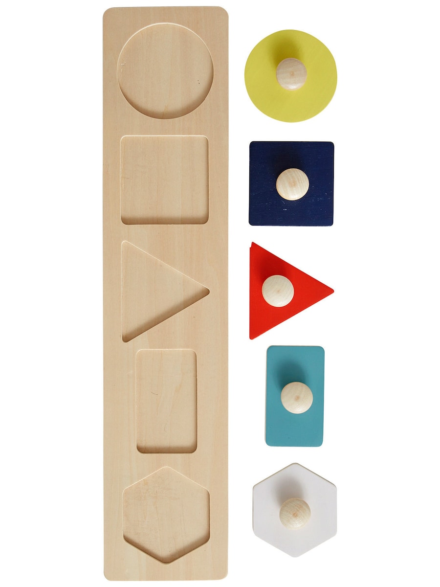 Detalj av knotter på puslespill med knotter i tre FSC® fra 10 mnd