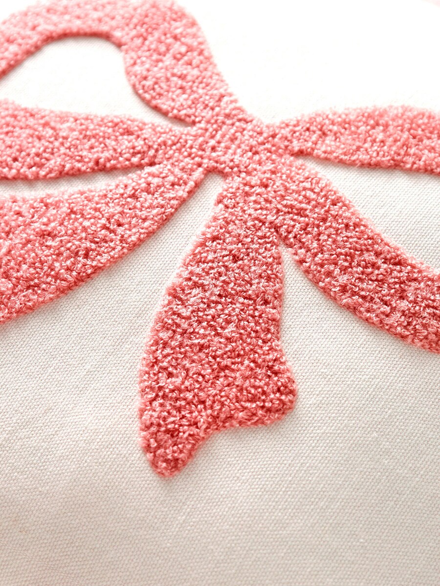 Detalj av tuftet sløyfe på pyntepute med sløyfe og pyntebord 40x40 cm bomull