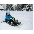 Rattkjelke Snowpower med brems og ratt på snødekt bakke
