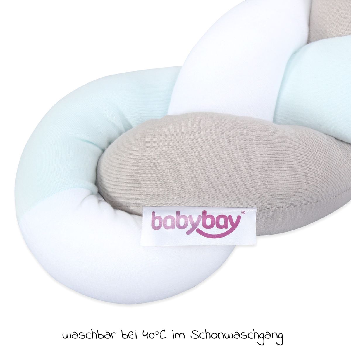 Nærbilde av materiale på sengebeskytter babybay 200 cm