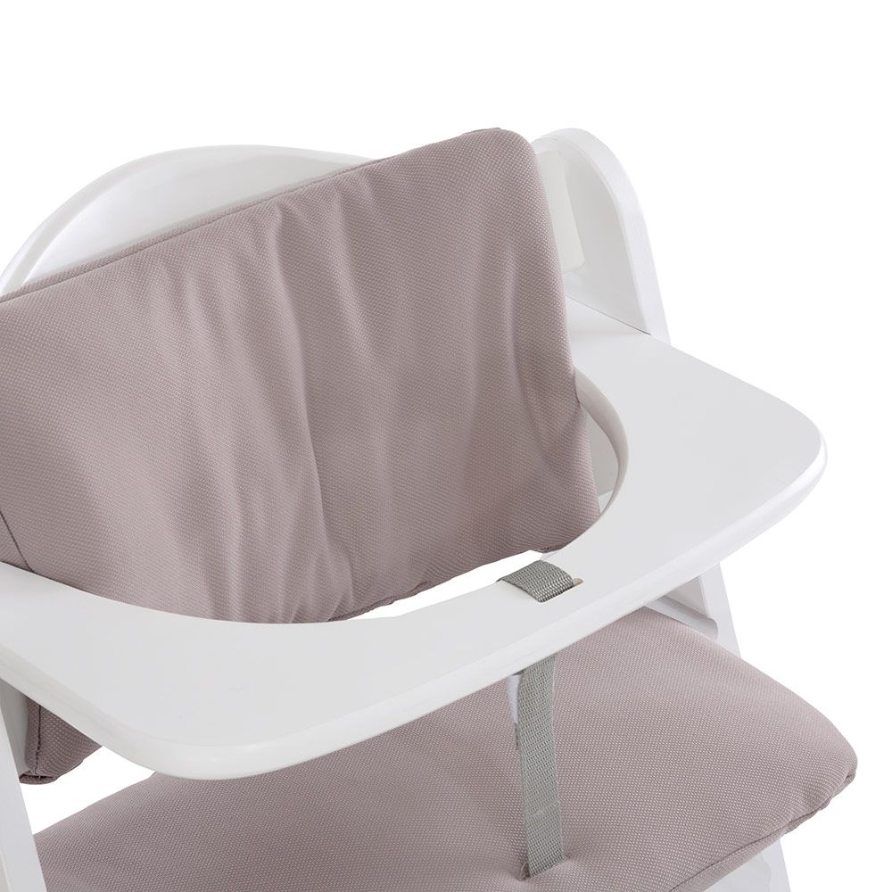 Detalj av borrelåsbånd på sittepute til barnestol Deluxe Alpha stretch beige