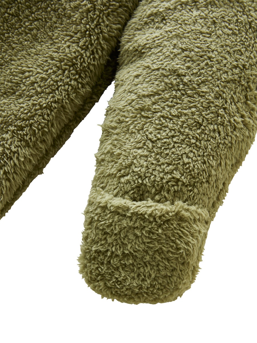 Nærbilde av stoff og fôr på Sovepose baby til bil i mikrofiber, TOG 3,5