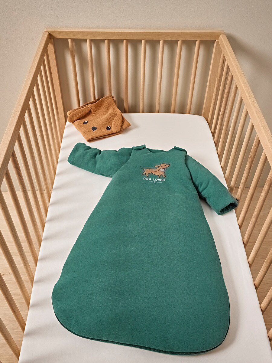 Detalj av sovepose for baby DACKEL med avtakbare ermer og hundemotiv