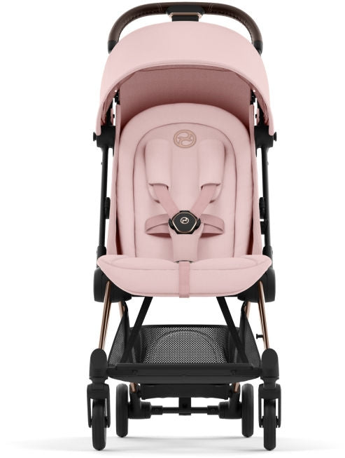Sportsvogn Coya ultrakompakt Rosegold Peach Pink detalj av håndtak
