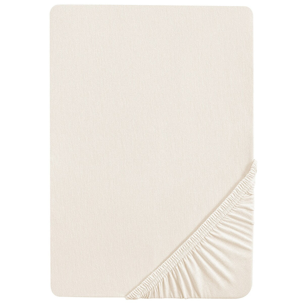 Stretchlaken 70x140 cm og 60x120 cm safe asleep jersey i bruk på barneseng