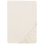 Stretchlaken 70x140 cm og 60x120 cm safe asleep jersey i bruk på barneseng