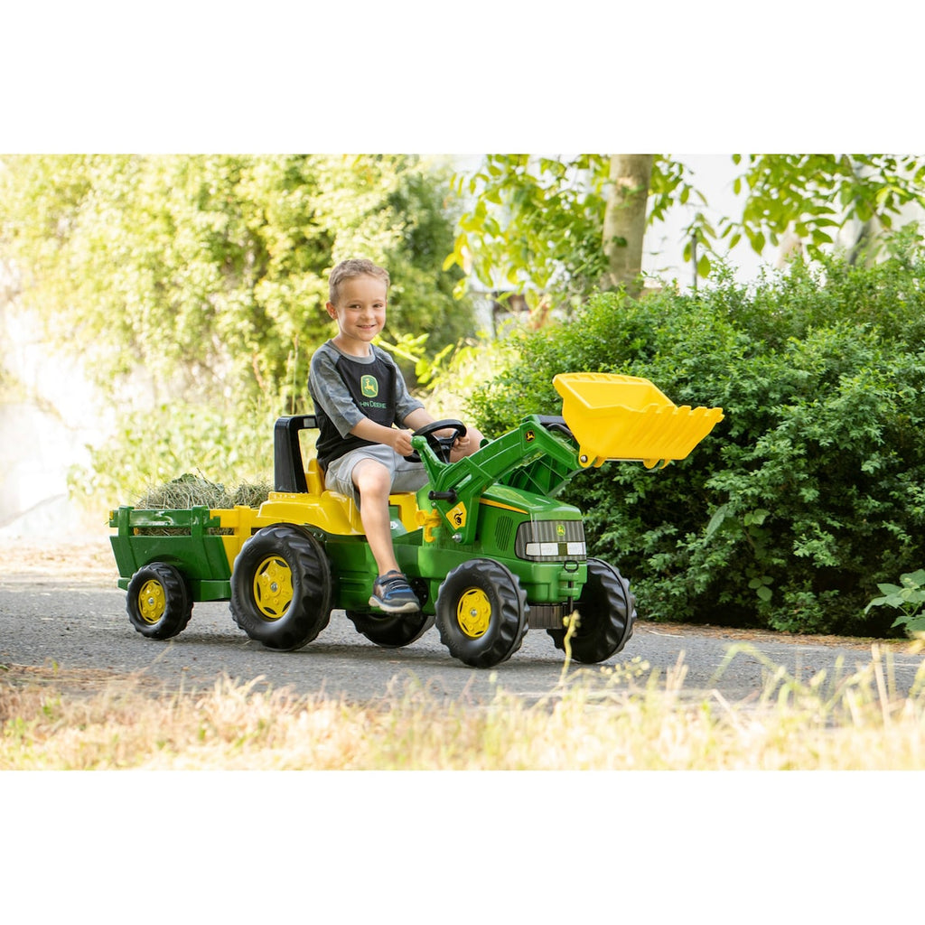 Detalj av tråkketraktor rollyJunior John Deere med henger