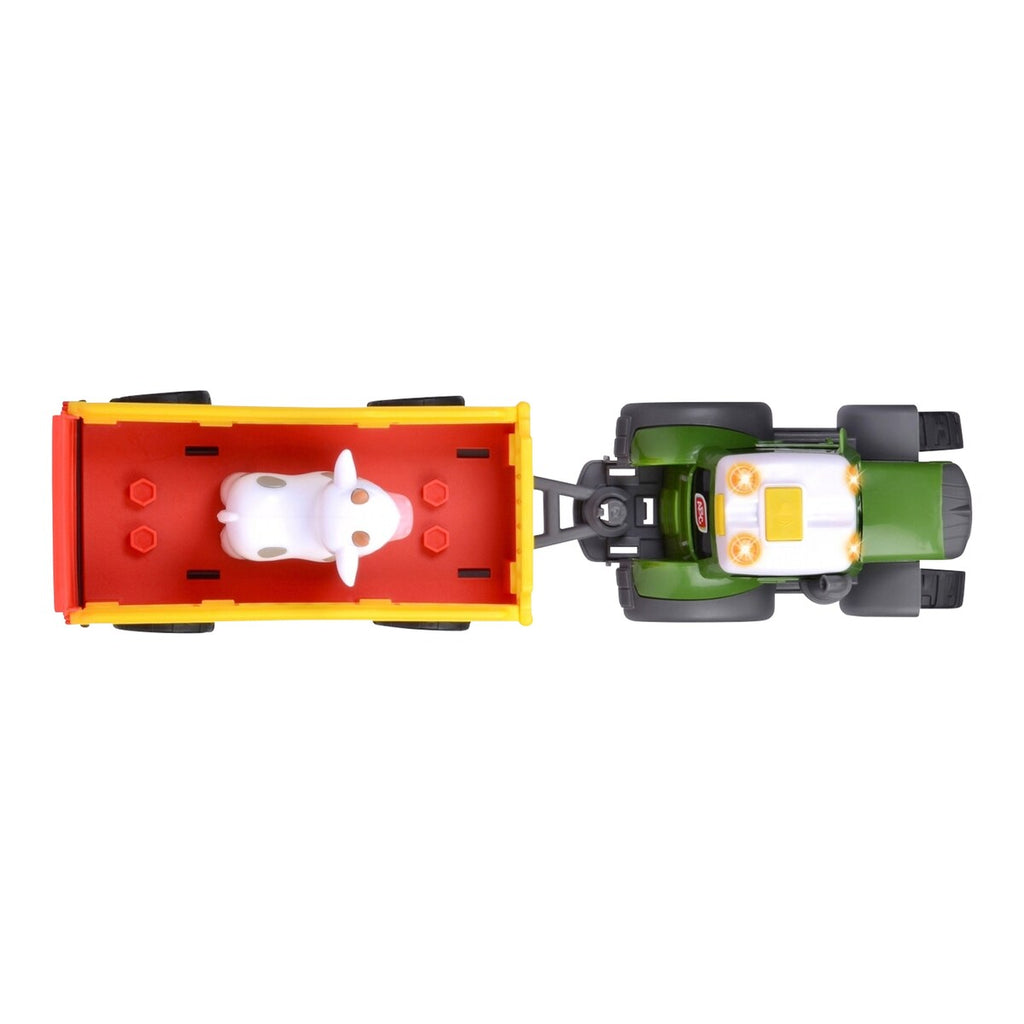 Nærbilde av ku-figur på Traktor Fendt med dyretilhenger