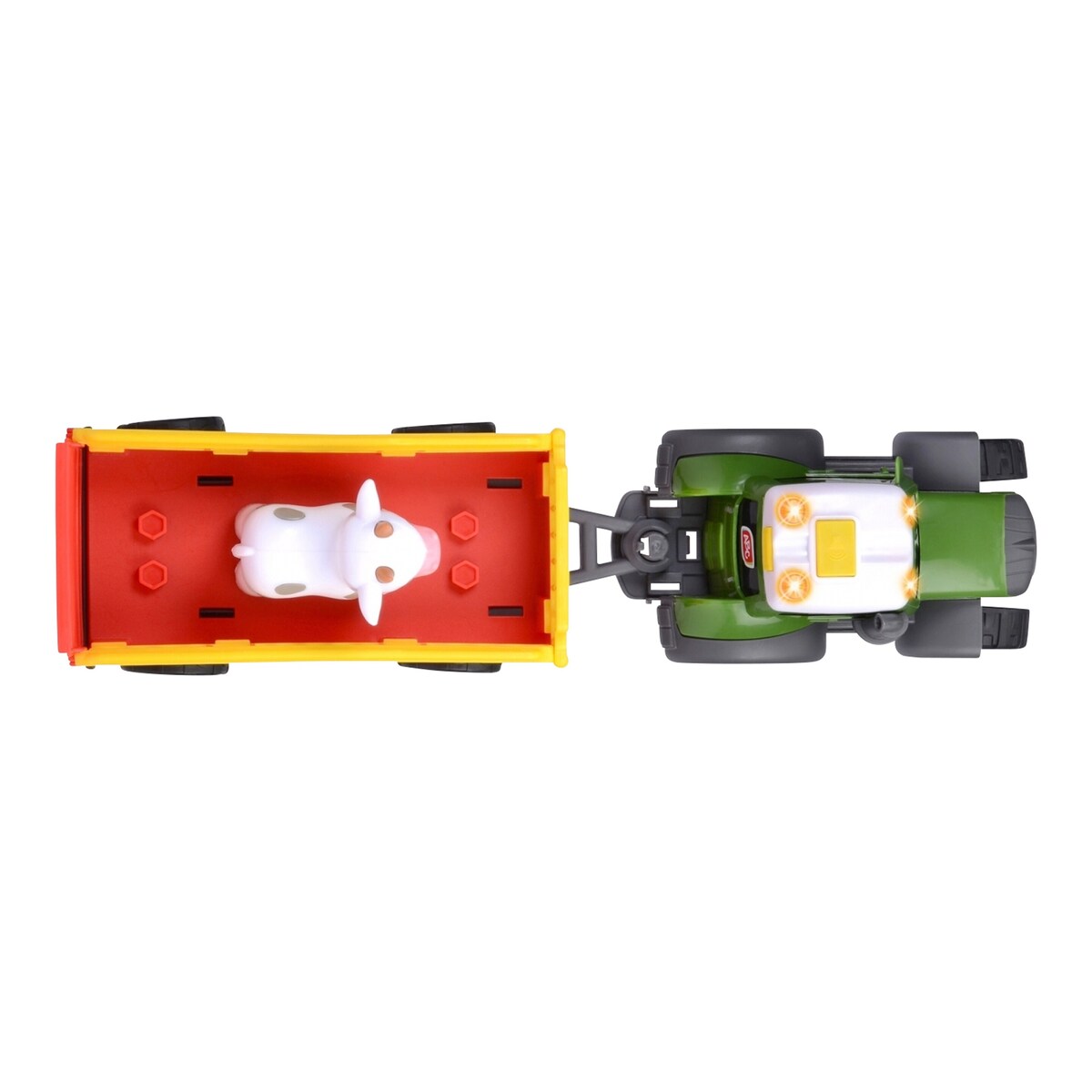 Nærbilde av ku-figur på Traktor Fendt med dyretilhenger