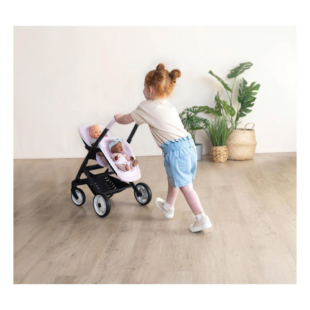 Nærbilde av Easy-Gripp håndtak på Tvillingdukkevogn Maxi-Cosi-design for dukker opptil 42 cm
