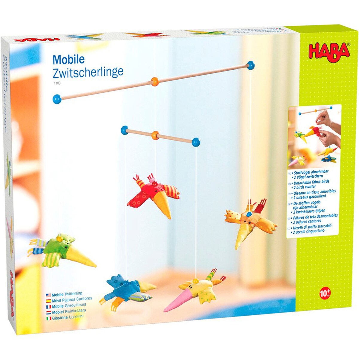 Nærbilde av magnetisk fuglefigur på uro i tre og stoff