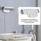 Varmelampe FeelWell til stellebord i bruk ved bleieskift