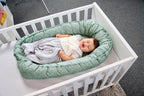 Detalj av snøring på Vendbart babynest TENCEL bomull med snøring hvit
