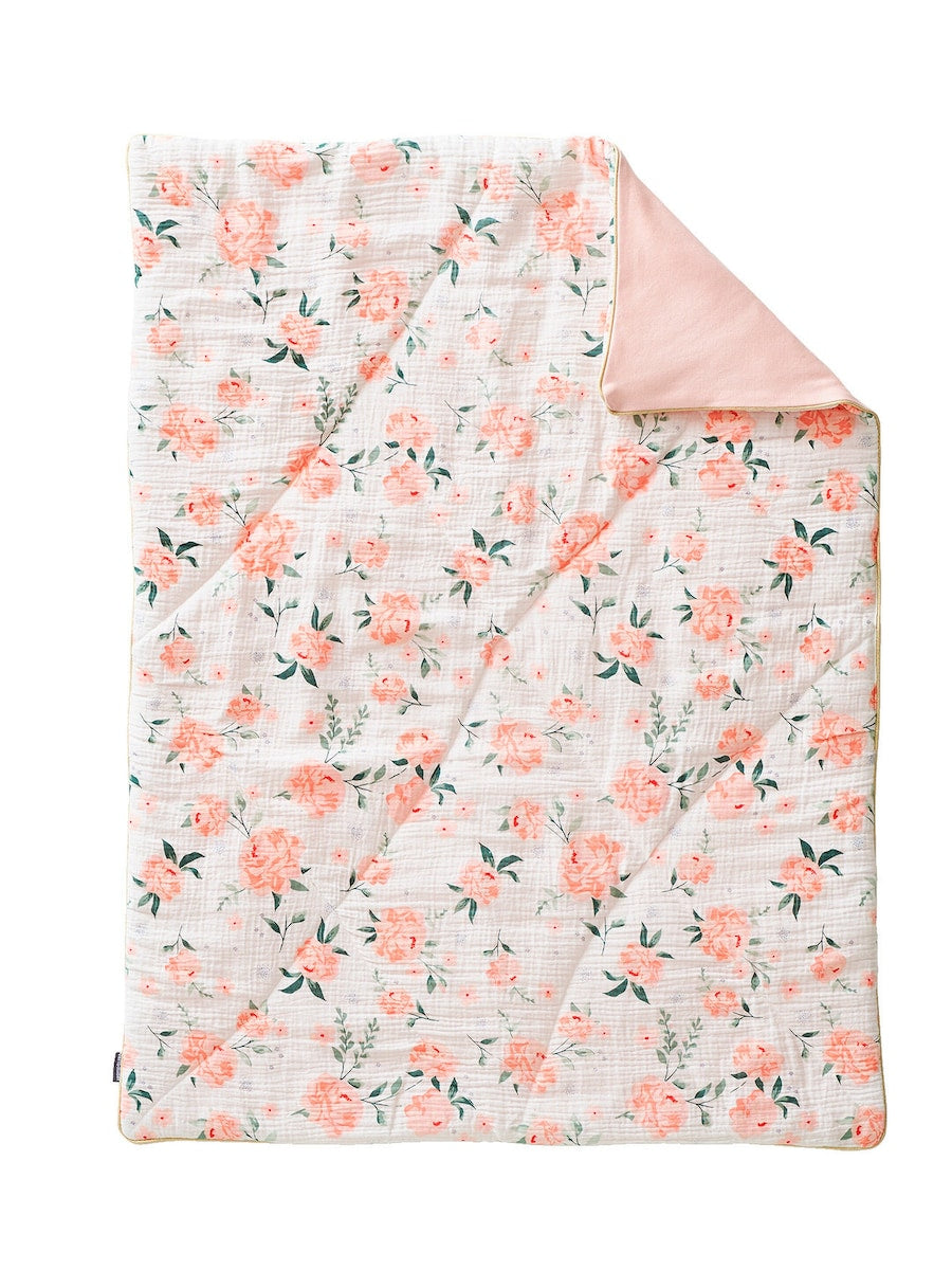 Bakside av vendbart leketeppe for baby i musselin 75x100 cm