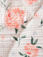 Vendbart leketeppe for baby i musselin 75x100 cm brettet