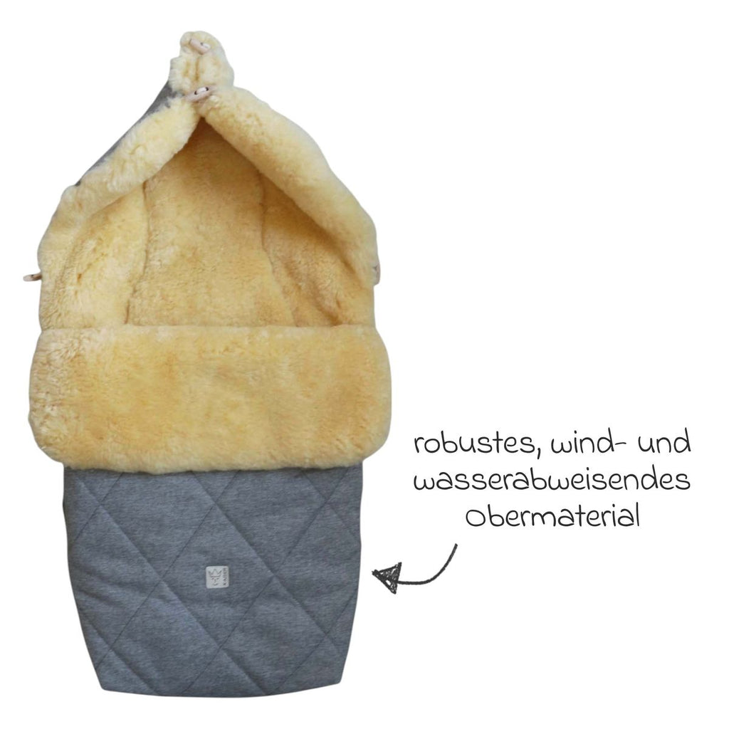 Vognpose Coosy i lammeskinn 85 x 45 cm sittepute funksjon